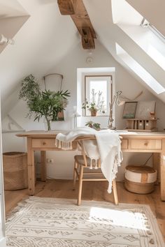 an attic bedroom with white walls and wood floors, wooden desk, potted plants on the window sill