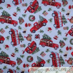 the fabric has red cars and christmas trees on it