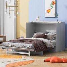 a bedroom with blue walls and white furniture