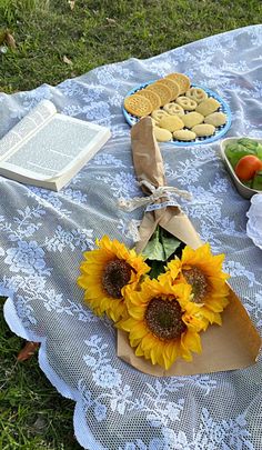 the sunflowers and cookies are on the table