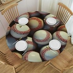 a table topped with lots of baseballs on top of a hard wood dining room table