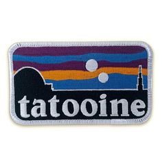 a patch with the word tattoone on it and an image of a sunset in the background