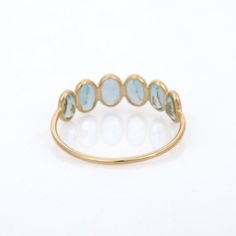 a gold ring with blue stones on it