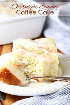 a piece of coffee cake on a white plate with a fork in front of it