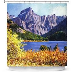 a painting of mountains and water on a shower curtain