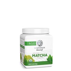 a jar of matcha powder on a white background