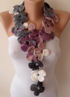 a crocheted flower necklace on a mannequin