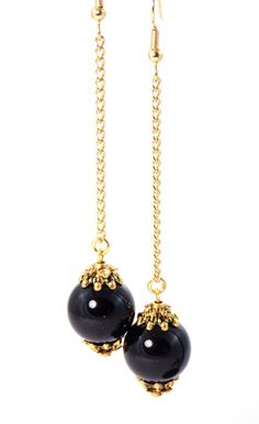 These gorgeous ball drop statement earrings have an elegant appearance with a luxurious feel! Semiprecious Black Onyx stones coupled with antique gold tones give these beauties a chic look! Earrings are lightweight making them very wearable! Earring hooks are 22k gold plated hypoallergenic and will help to avoid irritating the ears. Clip ons also available! Product Details .Semiprecious Black Onyx stones. .Antique gold plated bead caps. .Gold finished steel chain.  .22k gold plated head pins & jump rings. .22k gold plated hypoallergenic earring hooks. .Gold plated steel earring clips. .Size of stones - 14mm. Length of Earrings Including Hooks - 3½ inches. All items are shipped in a beautiful gold and teal packaging, ready for gifting! Earrings also available in: Blue Lapis - www.etsy.com/l Black Elegant Earrings, Drop Statement Earrings, Bijoux Fil Aluminium, Black Onyx Earrings, Initial Earrings, Ball Drop, Gold Statement Earrings, Earrings Clip, Statement Drop Earrings