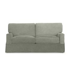 a gray couch sitting on top of a white floor