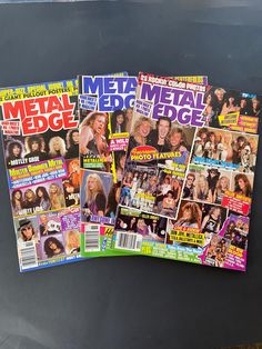 several magazines are stacked on top of each other