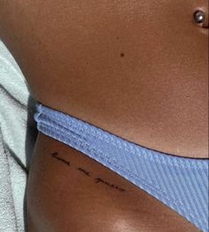 a close up of a person's stomach with the word love me written on it