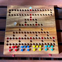 a wooden board game sitting on top of a table