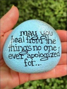 someone holding a rock with the words may you heal from the things no one ever applied for