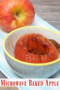 an apple is sitting in a bowl with a spoon next to it and the words microwave baked apples