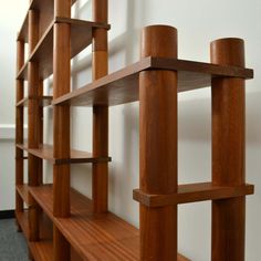 a wooden shelf with several shelves on it