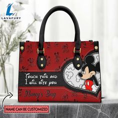 Custom Name I Will Bite You Mickey Mouse Pattern Premium Leather Handbag It’s a practical accessory for fashion-conscious individuals on the go and makes an excellent gift choice for special occasions. The bag is crafted with care and attention to detail, made of high-quality PU leather with a soft microfiber layer that protects your belongings. It features two zippered pockets, one flat pocket, and one detachable pocket, making it ideal for organizing your essentials. The bag is spacious enough Gift Satchel With Double Handle And Dust Bag, Valentine's Day Leather Rectangular Bag, Rectangular Leather Bag For Valentine's Day, Valentine's Day Leather Shoulder Bag Gift, Leather Shoulder Bag For Valentine's Day Gift, Everyday Customizable Red Bags, Casual Top Handle Shoulder Bag For Gift, Casual Top Handle Shoulder Bag As Gift, Gift Portable Shoulder Satchel