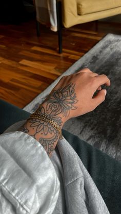 a person's arm with a tattoo on it