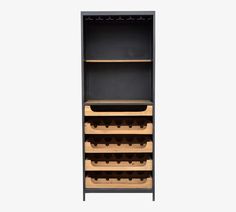 an open cabinet with wine glasses on the bottom shelf and shelves below it, against a white background