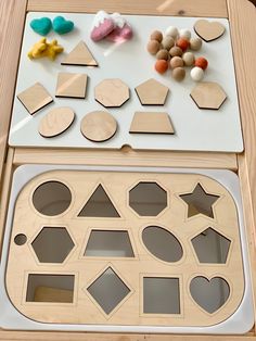 wooden shapes are displayed on a table