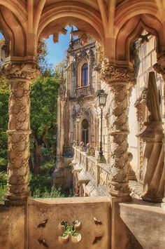 an old building with columns and arches in front of the building is seen from inside