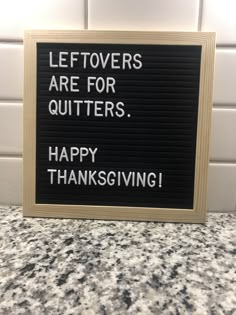 a sign that says leftovers are for quitters happy thanksgiving on the counter top