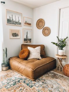 a living room filled with lots of furniture and pictures on the wall above it's couch