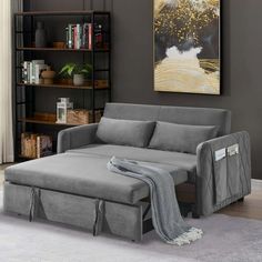 a living room scene with focus on the grey couch and chaise - long sofa