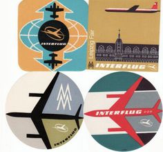 four circular stickers with different types of travel related items in the middle one has an airplane, and the other has a city