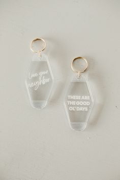 two clear acrylic keychains that say, one is for each other there are the good old days