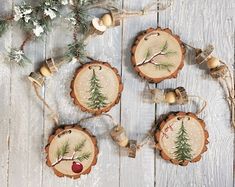 christmas ornaments made out of wood with pine trees on them