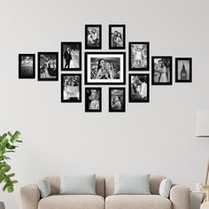 a living room with a couch, table and pictures on the wall above it that are black and white