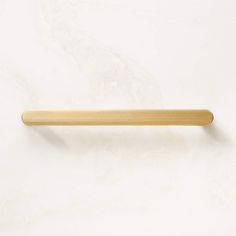 a wooden handle on a white wall