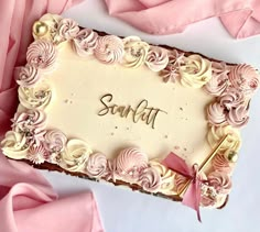 a birthday cake with pink frosting and flowers on it that says sondaf