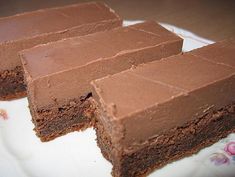 chocolate cake sitting on top of a white plate