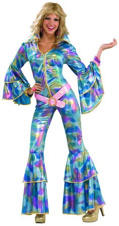 a woman in a disco costume posing for the camera with her arms out and one hand on her hip