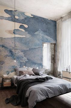 a bedroom with a map on the wall