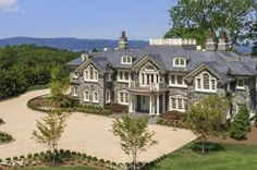 an aerial view of a large stone house