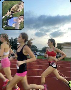 three girls running on a race track in the evening and one girl is looking at her cell phone