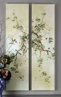 two paintings with birds on them next to a vase