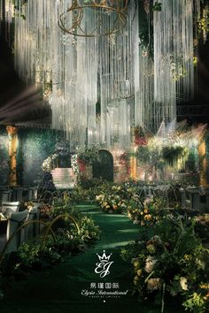 an elaborate garden with chandeliers hanging from the ceiling and flowers on the ground