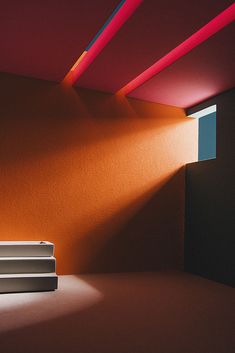 an empty room with red and blue lights coming from the ceiling, along with some steps leading up to it