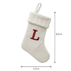 a white christmas stocking with the letter l on it's side and a red initial