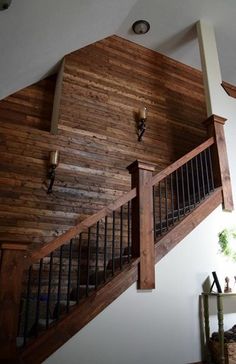 the stairs are made from wood and have metal railings