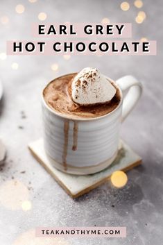 a cup of hot chocolate with marshmallows on top and the words creamy & delicious