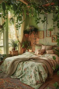 a bed covered in lots of plants next to a window