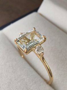 an engagement ring with two diamonds in it