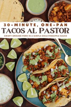 tacos al pastora on a plate with limes and cilantro