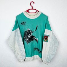 Beautiful vintage Adidas sweater from the 90s. Very rare model. Good used condition. Size approximately M Pit to pit: 60cm Back length: 66 cm 90s Graphic Print Sweater For Streetwear, Vintage Graphic Print Winter Sweatshirt, Vintage Winter Graphic Print Sweatshirt, Winter Vintage Graphic Print Sweatshirt, Retro Crew Neck Sweatshirt For Winter, 90s Long Sleeve Streetwear Sweater, Retro Crew Neck Sweater For Streetwear, Retro Graphic Print Sweatshirt For Winter, 90s Style White Crew Neck Sweater