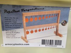 an advertisement for popshot target stand on the shelf in a store display case with price tags