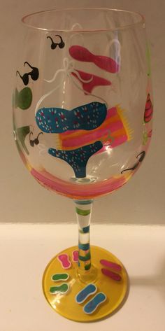 a wine glass with different designs on it